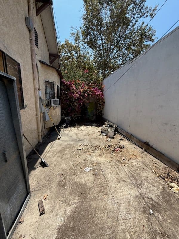 Project Expert Junk Removal Transforms Cluttered Alley image