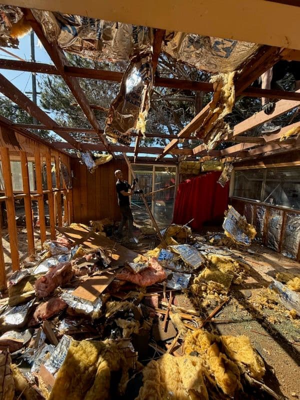 Home with trees and an orange sunset