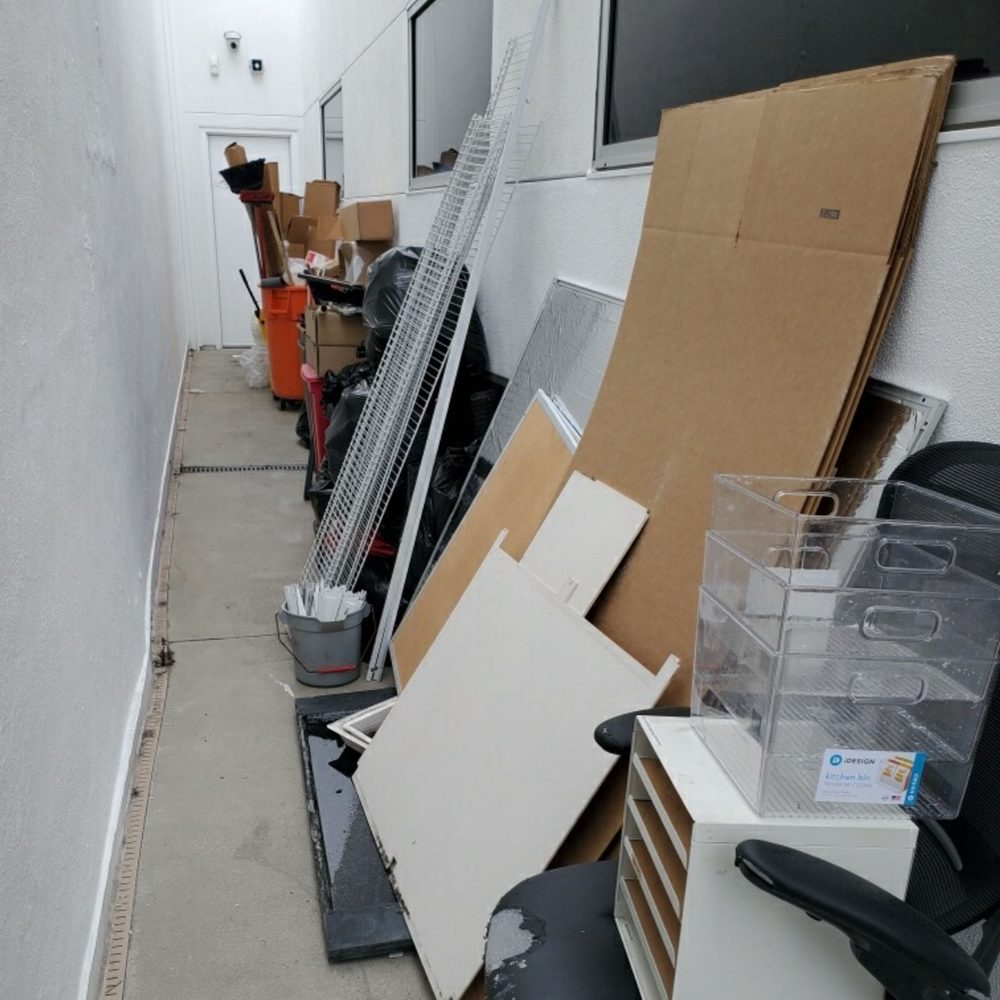 Office furniture and panels stacked for a commercial clean out