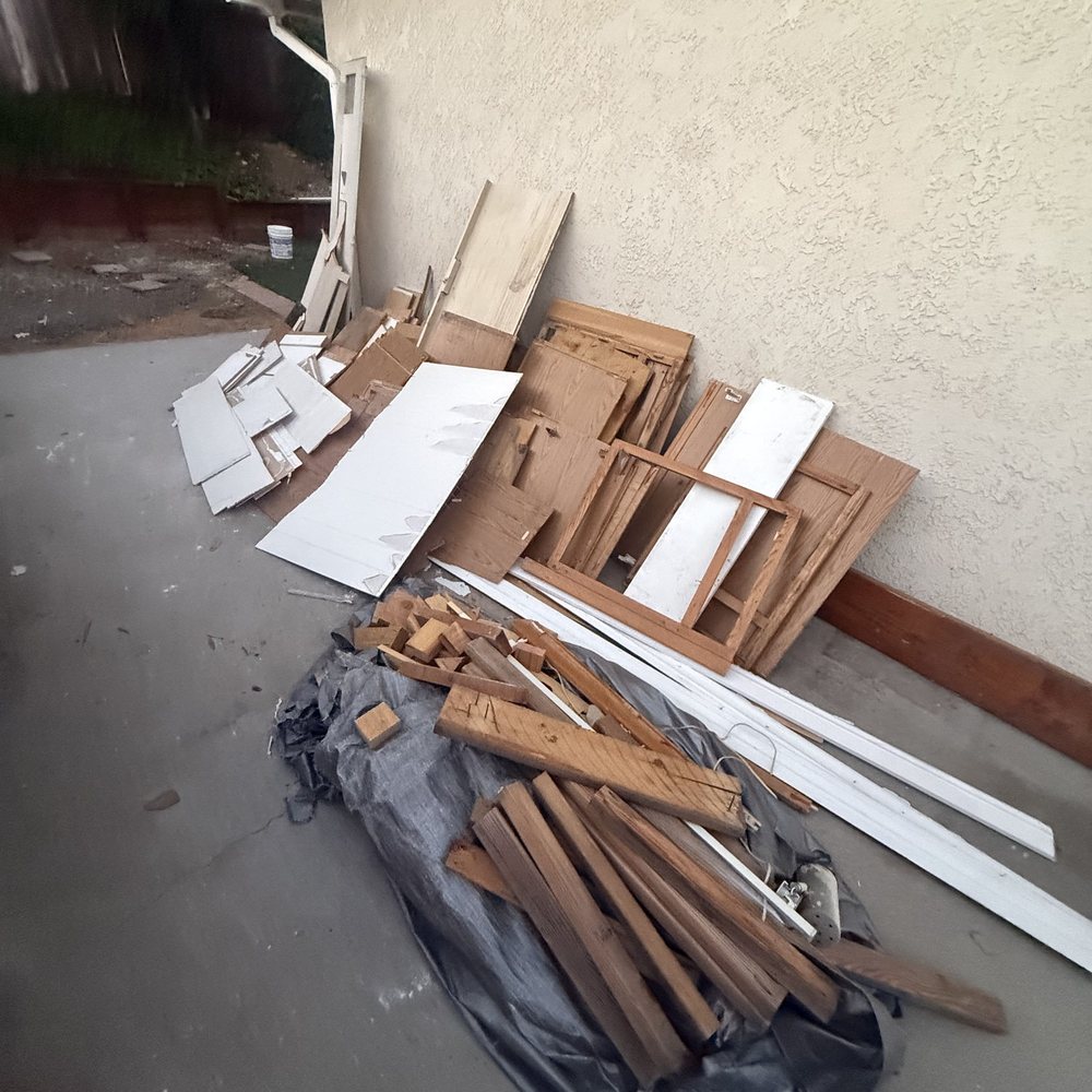 Old lumber and panels left after a small demolition job